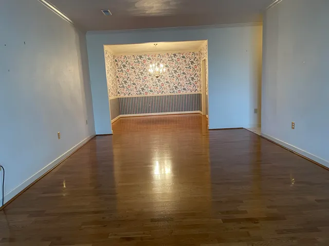 a kitchen with stainless steel appliances granite countertop a stove and a refrigerator