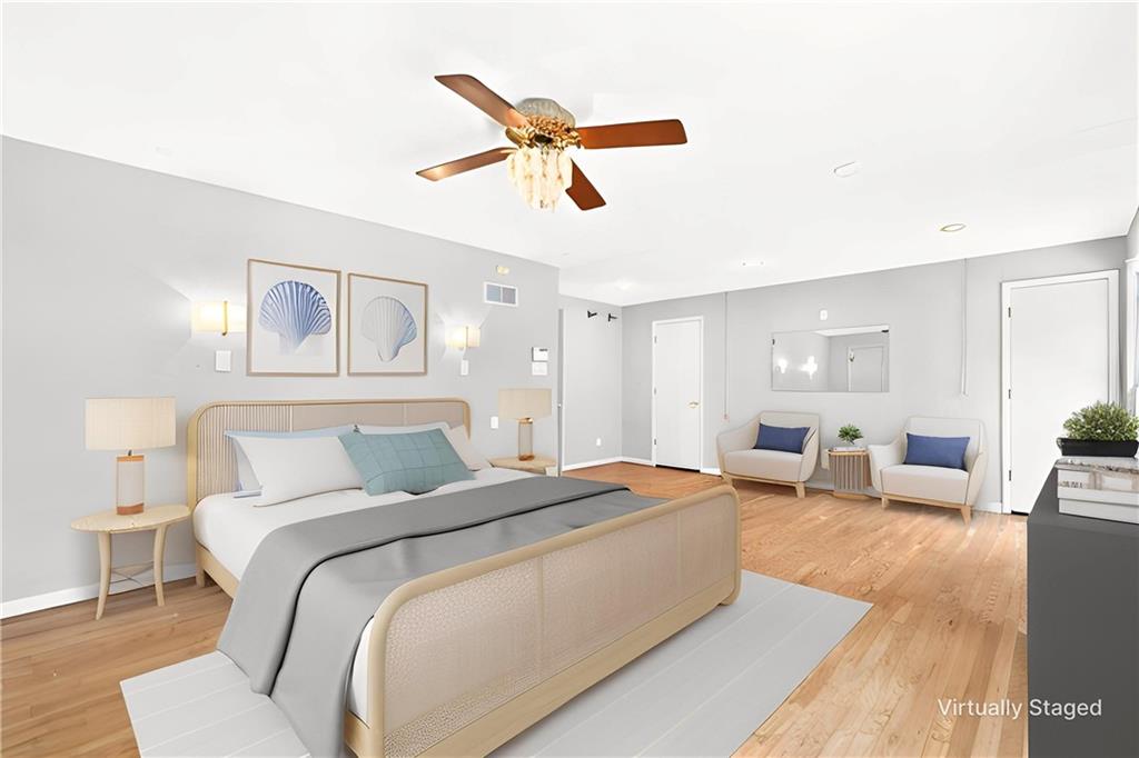 1443 Stoltz Road Bethel Park, PA 15102 - Photo 12 of 49 a bedroom with a large bed and ceiling fan