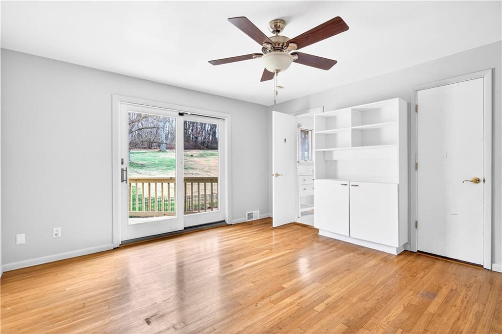 1443 Stoltz Road Bethel Park, PA 15102 - Photo 16 of 49 a view of an empty room with a window and wooden floor