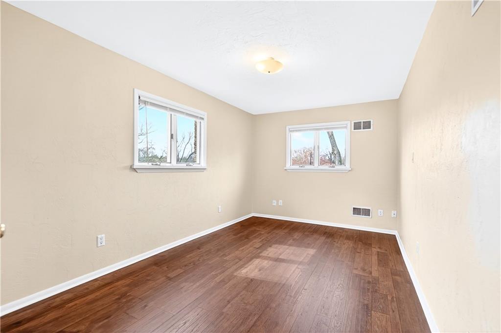 1443 Stoltz Road Bethel Park, PA 15102 - Photo 20 of 49 an empty room with wooden floor and windows