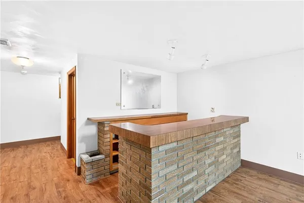 a front view of house with yard outdoor seating and barbeque oven