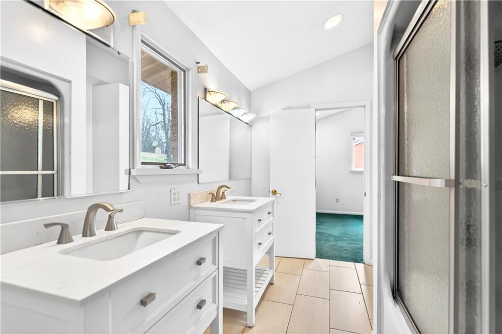 1443 Stoltz Road Bethel Park, PA 15102 - Photo 25 of 49 a bathroom with a sink and a mirror