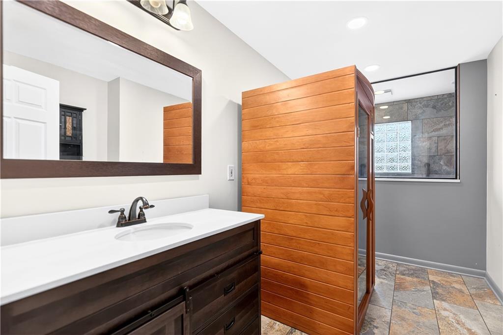 1443 Stoltz Road Bethel Park, PA 15102 - Photo 31 of 49 a bathroom with a sink and a mirror