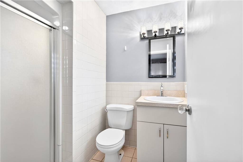 1443 Stoltz Road Bethel Park, PA 15102 - Photo 37 of 49 a bathroom with a toilet a sink and mirror
