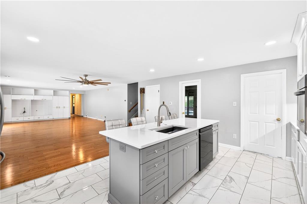 1443 Stoltz Road Bethel Park, PA 15102 - Photo 5 of 49 a kitchen with a sink and cabinets