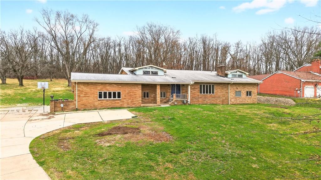 1443 Stoltz Road Bethel Park, PA 15102 - Photo 7 of 49 a front view of a house with garden