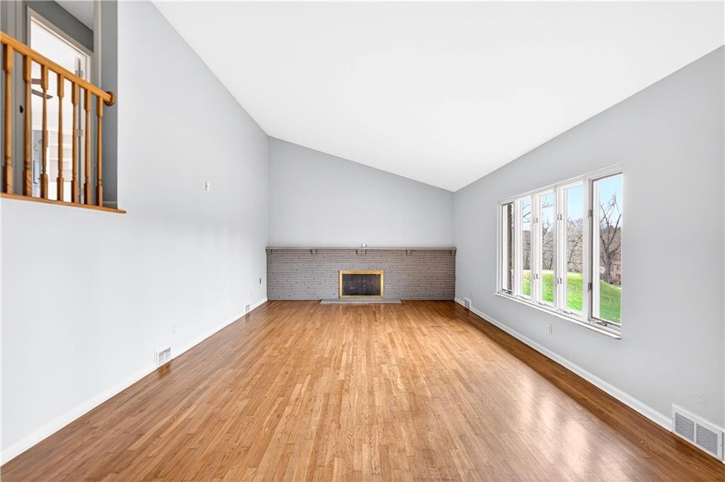 1443 Stoltz Road Bethel Park, PA 15102 - Photo 9 of 49 a view of an empty room with wooden floor and a window