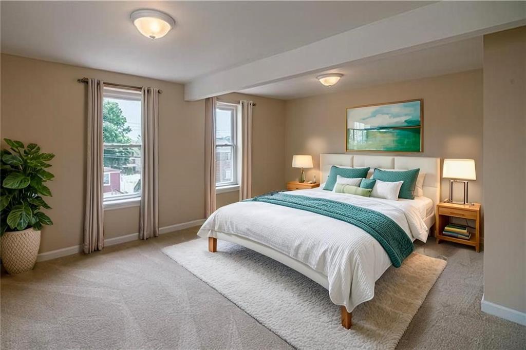 925 Greenhill Road Pittsburgh, PA 15209 - Photo 14 of 27 a bedroom with a large bed and a potted plant
