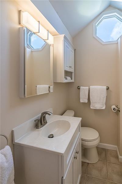 925 Greenhill Road Pittsburgh, PA 15209 - Photo 19 of 27 a bathroom with a sink a toilet and mirror
