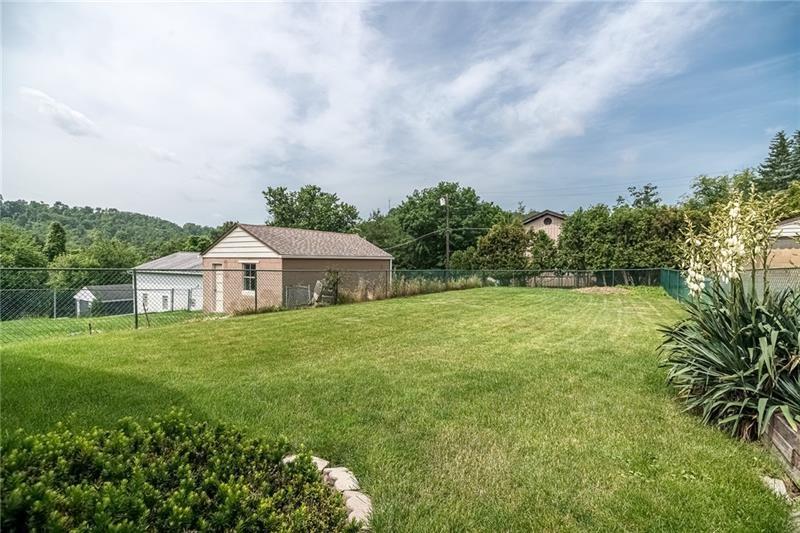 925 Greenhill Road Pittsburgh, PA 15209 - Photo 26 of 27 a view of a big house with a big yard and large trees
