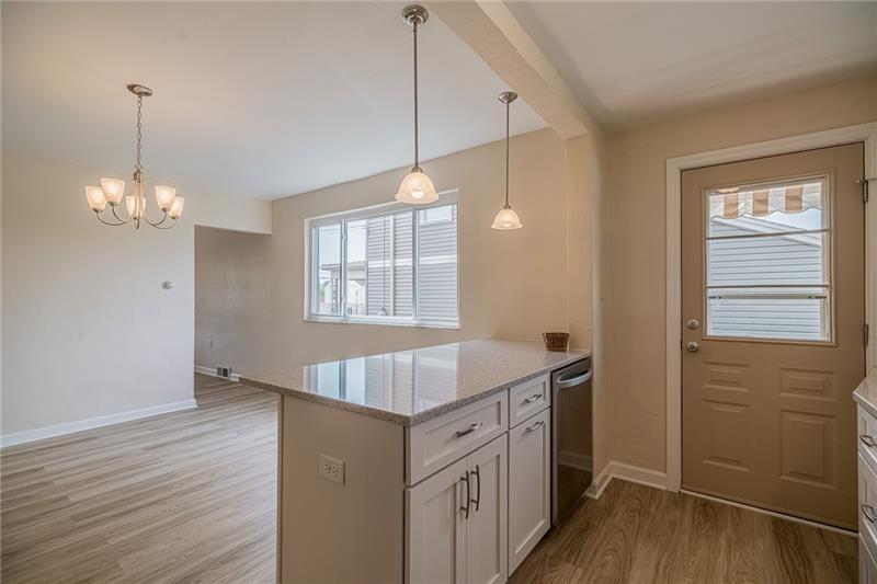 925 Greenhill Road Pittsburgh, PA 15209 - Photo 3 of 27 a kitchen that has a lot of cabinets and wooden floor