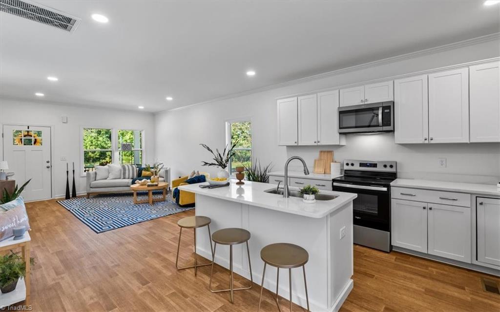 1622 Rankin Road Greensboro, NC 27405 - Photo 7 of 23 Quartz Counters are durable and beautiful.