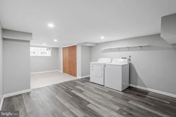 a view of a storage & utility room with closet window