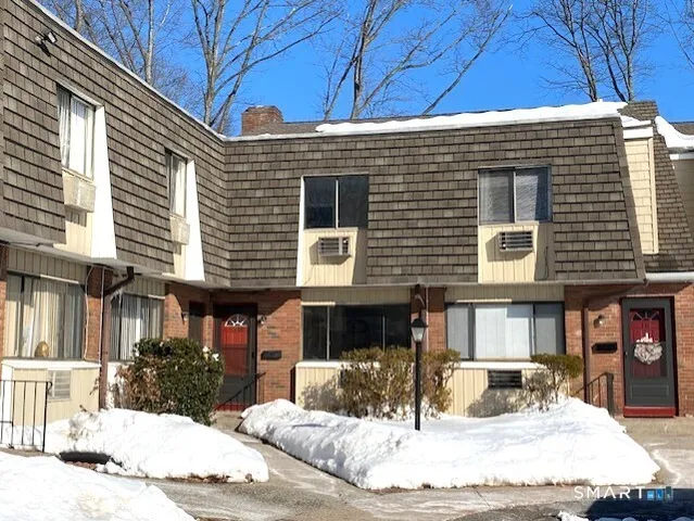 a view of a building with a table and chairs