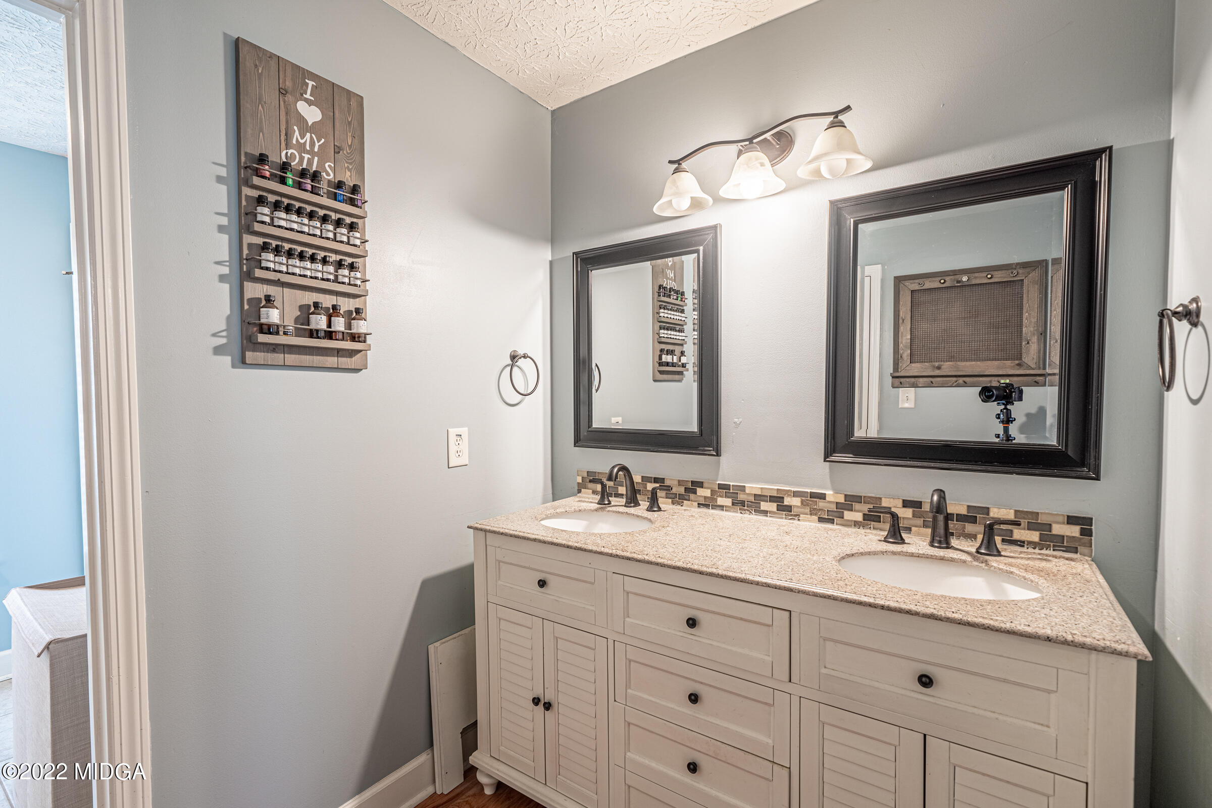 229 Howard Roberts Road Gray, GA 31032 - Photo 11 of 28 a bathroom with a sink double vanity and a mirror