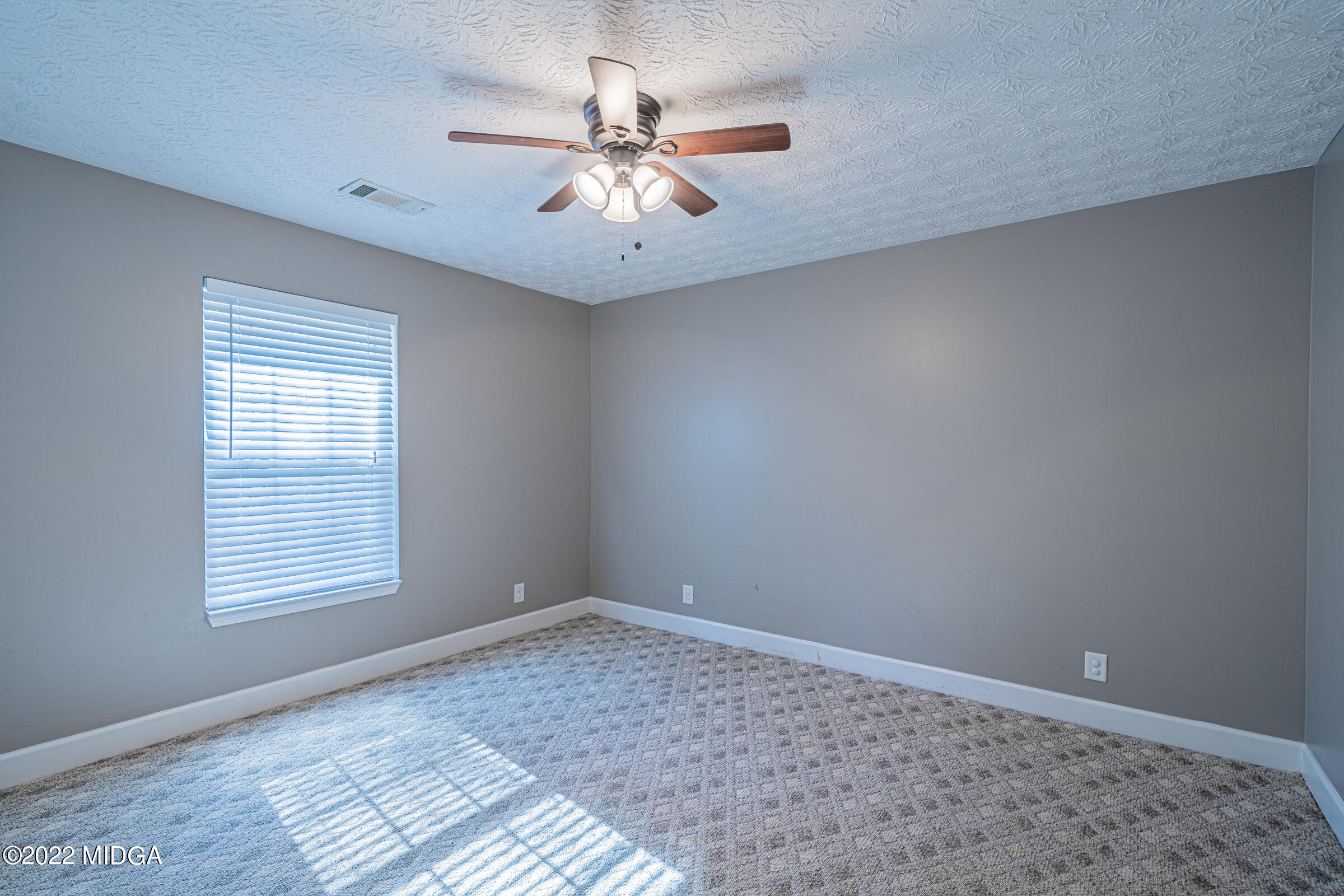 229 Howard Roberts Road Gray, GA 31032 - Photo 16 of 28 a view of an empty room with a window