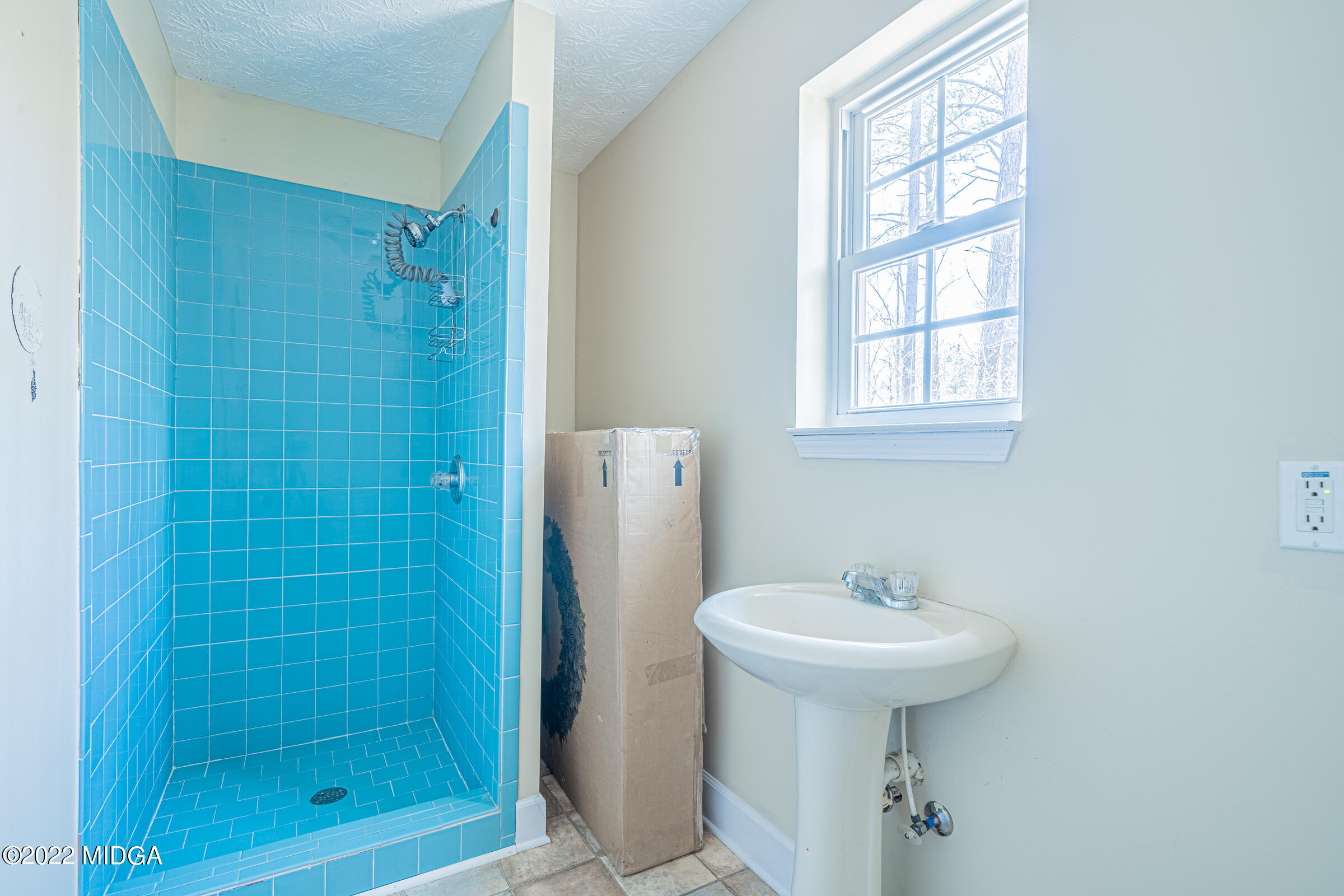 229 Howard Roberts Road Gray, GA 31032 - Photo 20 of 28 a bathroom with a sink a toilet and shower