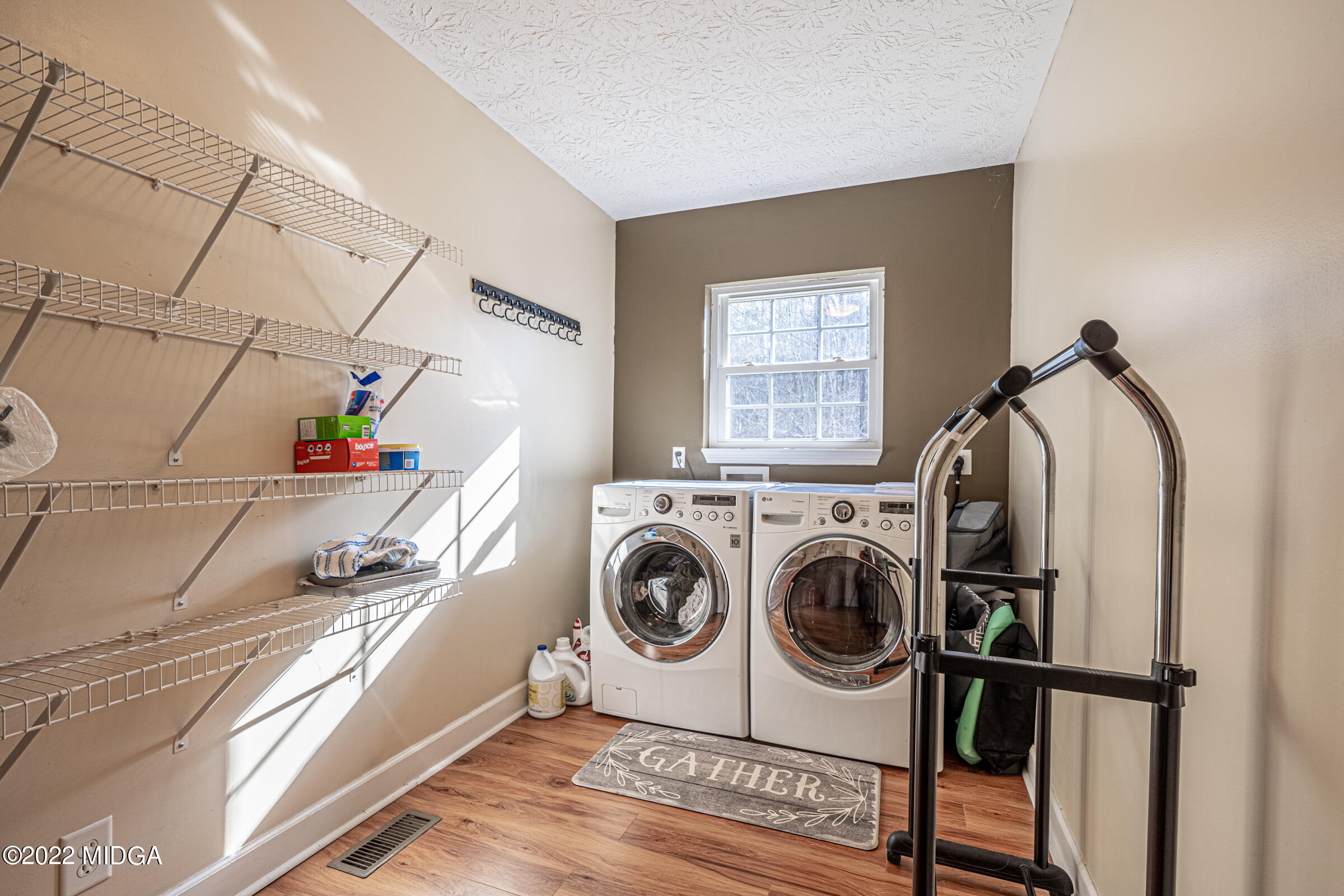 229 Howard Roberts Road Gray, GA 31032 - Photo 21 of 28 a utility room with dryer and washer