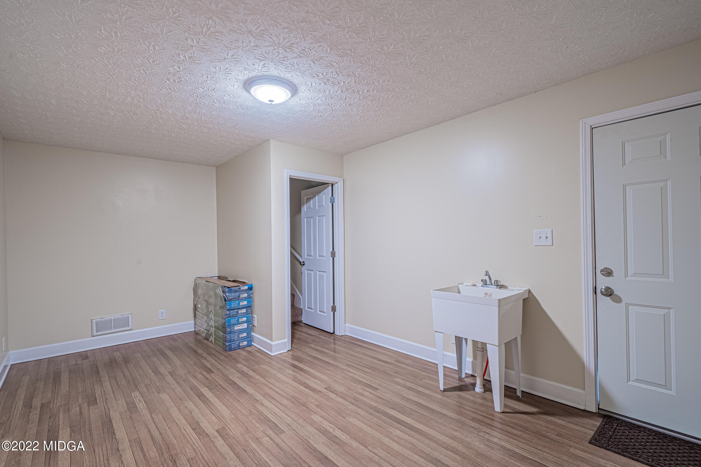 229 Howard Roberts Road Gray, GA 31032 - Photo 22 of 28 a view of empty room with wooden floor
