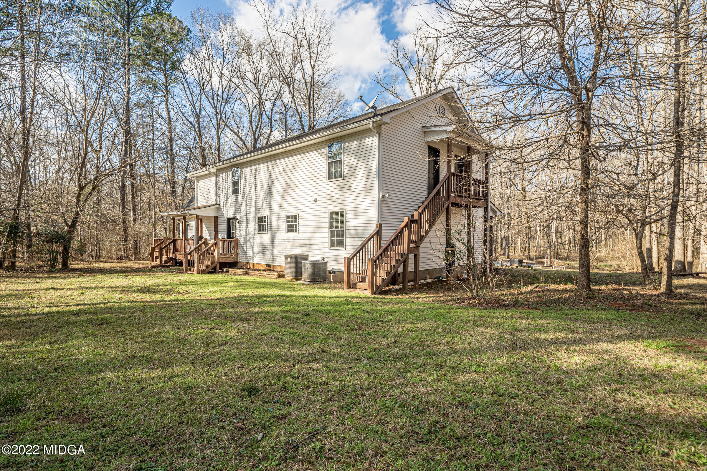 229 Howard Roberts Road Gray, GA 31032 - Photo 23 of 28 a view of a house with a large tree and a yard