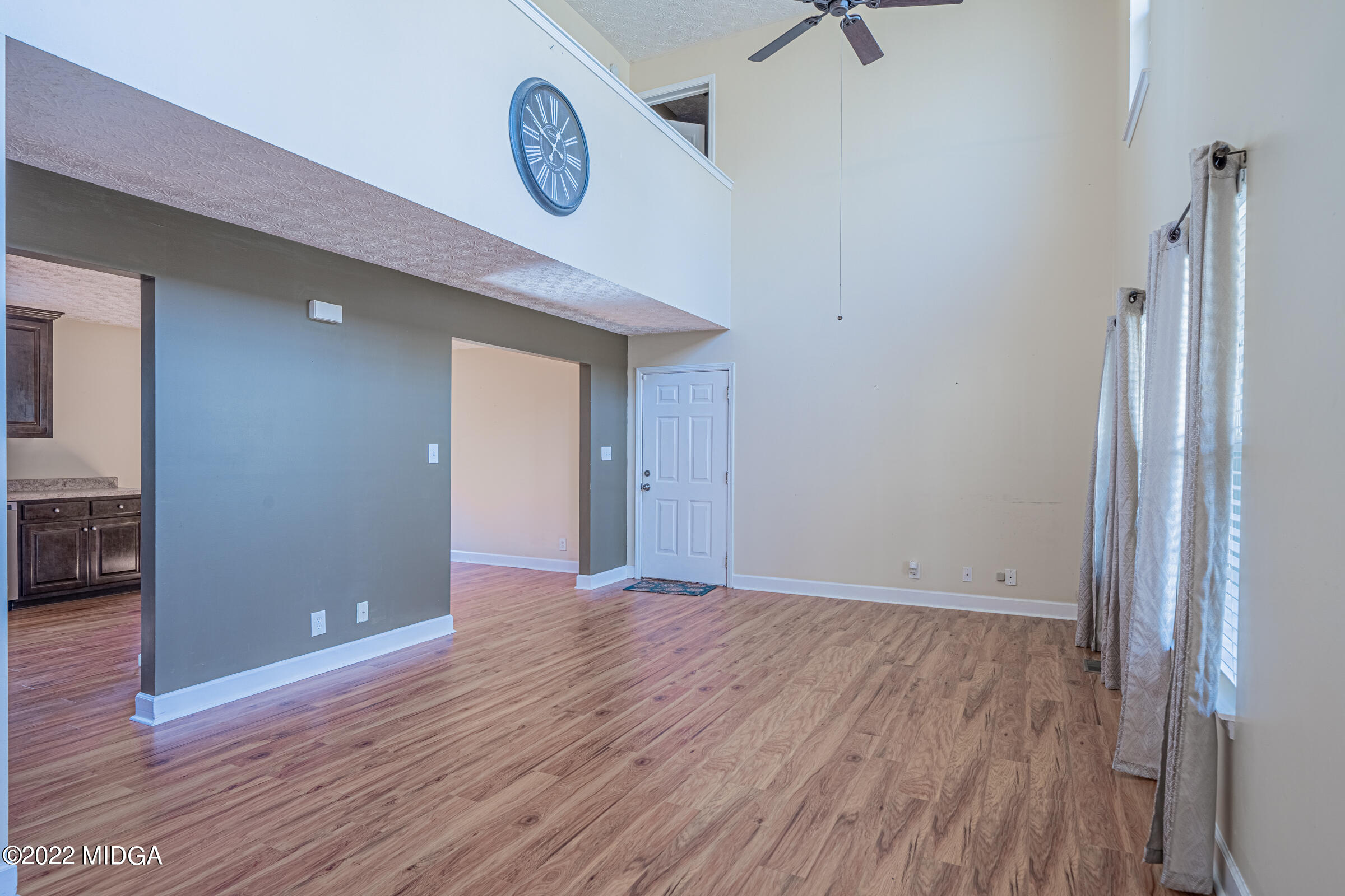 229 Howard Roberts Road Gray, GA 31032 - Photo 3 of 28 a view of an empty room with wooden floor