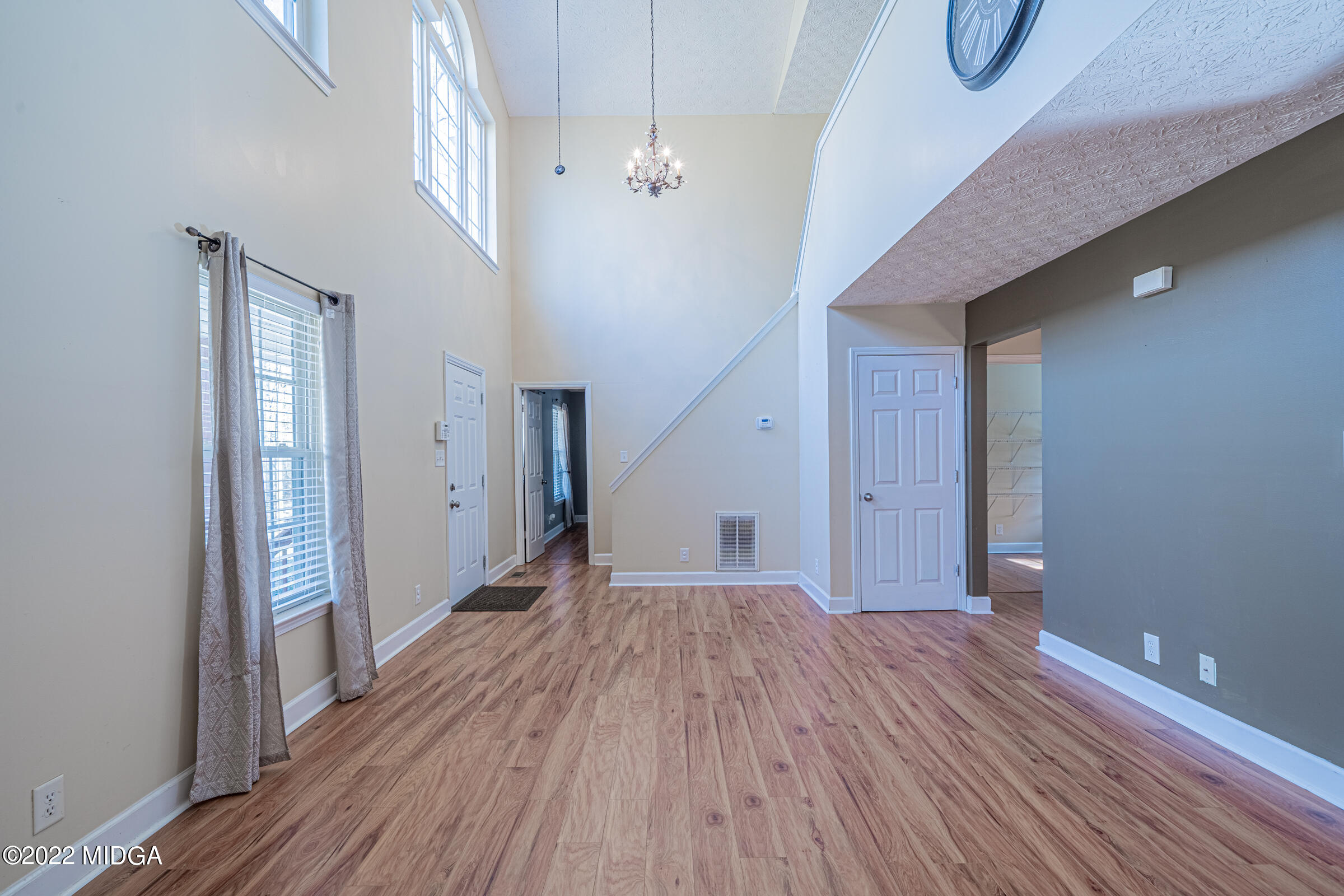 229 Howard Roberts Road Gray, GA 31032 - Photo 4 of 28 a view of hallway with stairs and wooden floor
