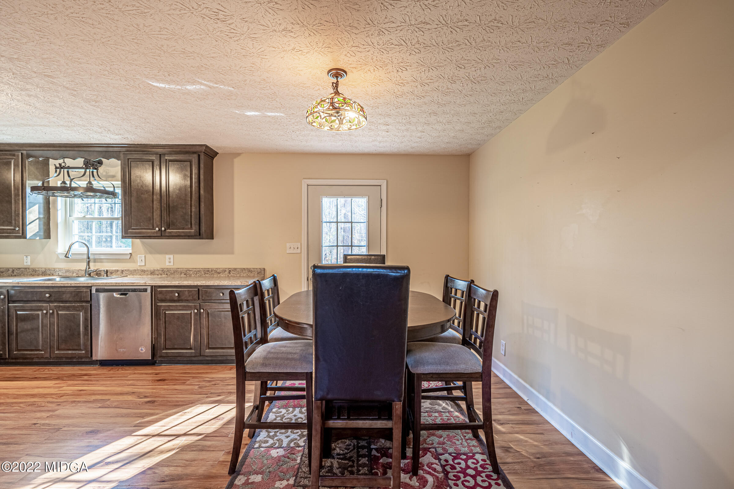 229 Howard Roberts Road Gray, GA 31032 - Photo 8 of 28 a view of a dining room with furniture and window