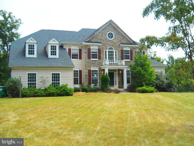 2375 Mountain Road Haymarket, VA 20169 - Photo 1 of 19 a front view of a house with a yard