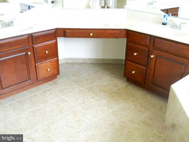 2375 Mountain Road Haymarket, VA 20169 - Photo 11 of 19 a bathroom with a sink and a mirror
