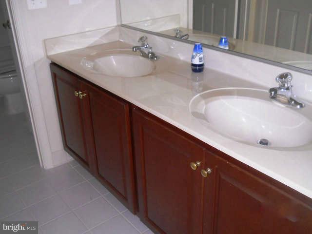 2375 Mountain Road Haymarket, VA 20169 - Photo 16 of 19 a bathroom with a sink and a mirror