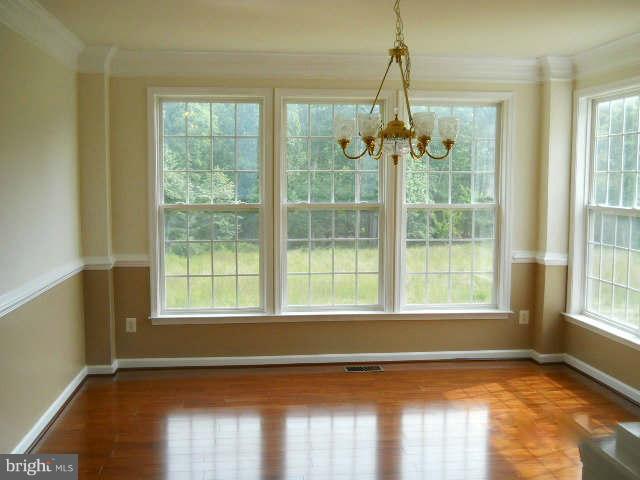 2375 Mountain Road Haymarket, VA 20169 - Photo 4 of 19 a view of an empty room with wooden floor and a window
