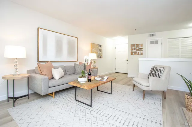 a living room with furniture and a table