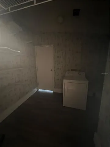 a storage room with wooden floor