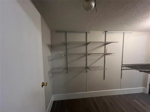 a view of an empty room with windows