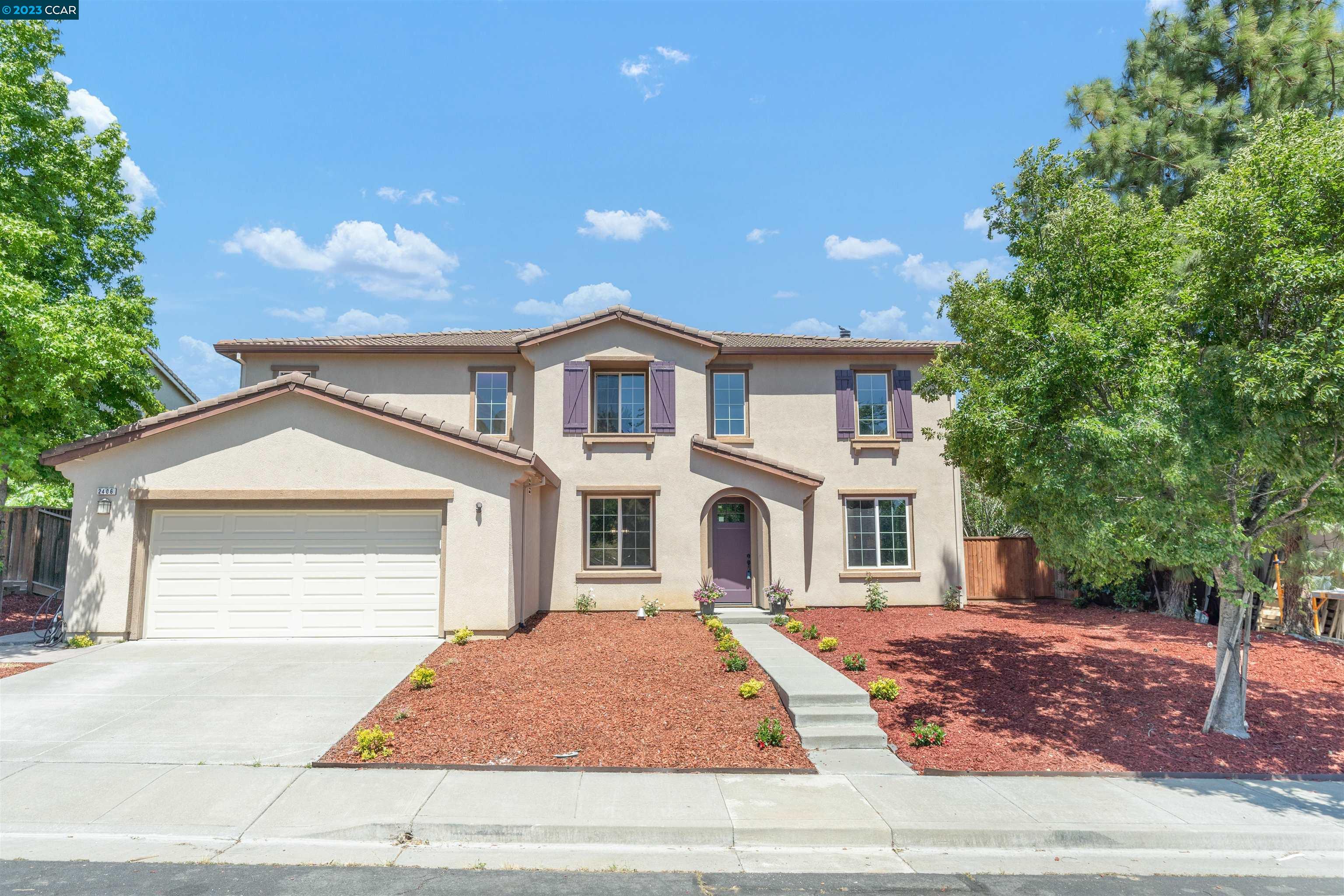 a front view of a house with yard