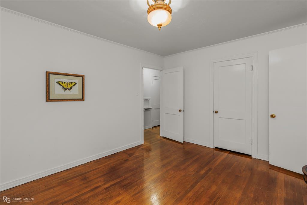 515 Davis Street Minden, LA 71055 - Photo 17 of 28 a view of empty room with wooden floor
