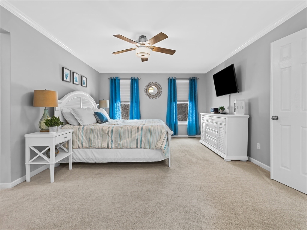 244 Robert Road Marlborough, MA 01752 - Photo 20 of 41 a bedroom with a bed and a flat screen tv