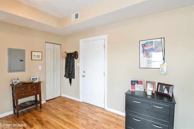 2709 West Lawrence Avenue, Unit 3 Chicago, IL 60625 - Photo 9 of 10 a bedroom with a bed and a desk