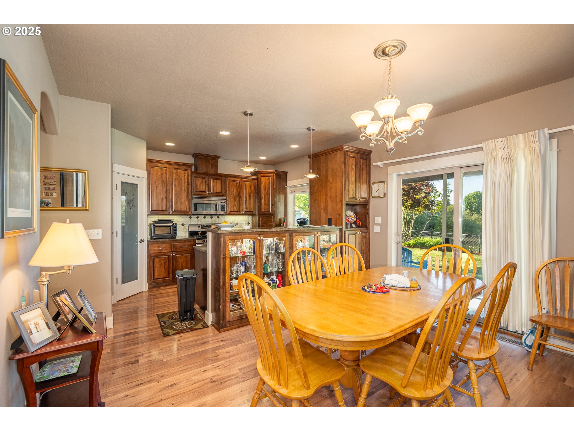 4756 Jessen Drive Eugene, OR 97402 - Photo 12 of 29 a view of a dining room with furniture and chandelier