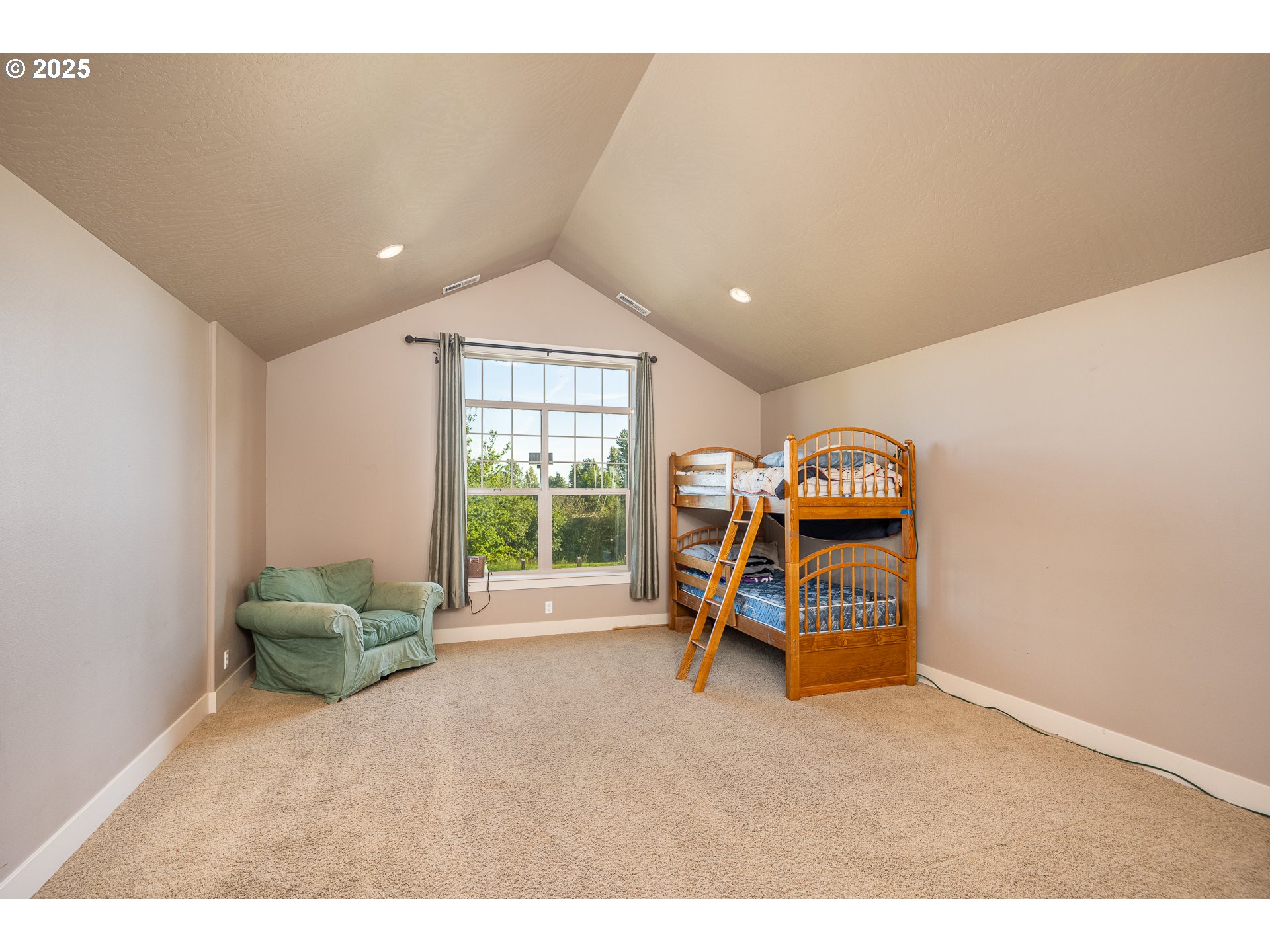 4756 Jessen Drive Eugene, OR 97402 - Photo 16 of 29 a living room with a desk and gym equipment
