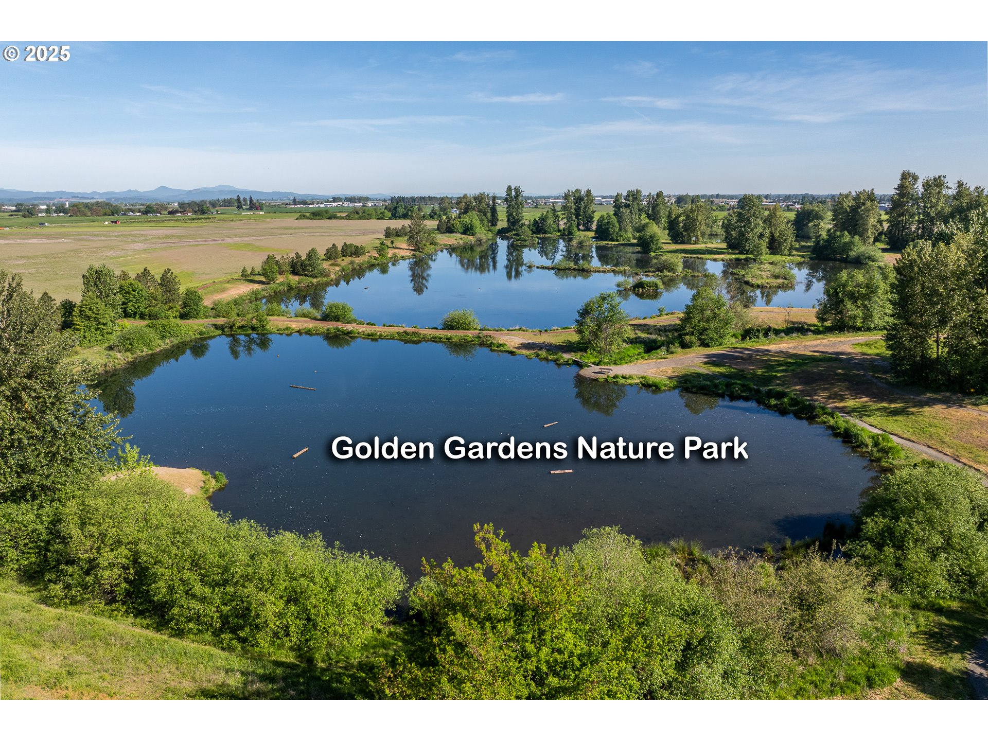 4756 Jessen Drive Eugene, OR 97402 - Photo 26 of 29 a view of a park with a bench and lake view