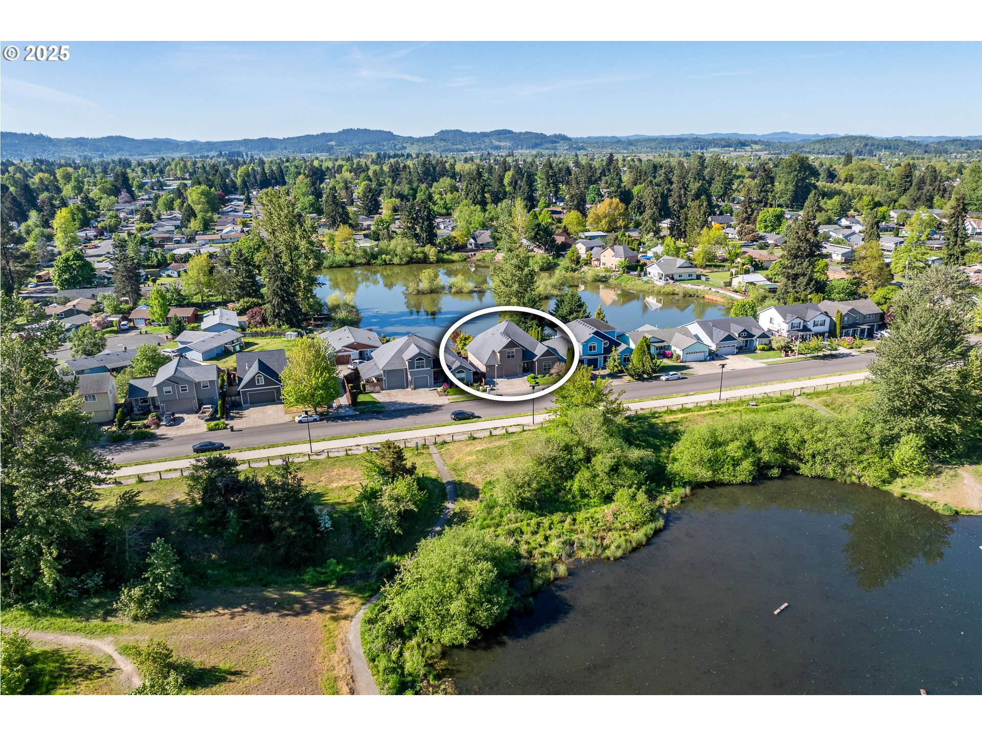 4756 Jessen Drive Eugene, OR 97402 - Photo 27 of 29 an aerial view of a house with a yard and lake view