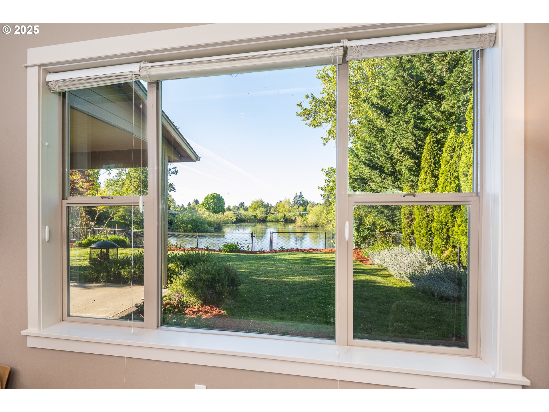 4756 Jessen Drive Eugene, OR 97402 - Photo 10 of 29 a view of a glass door and a yard from a window