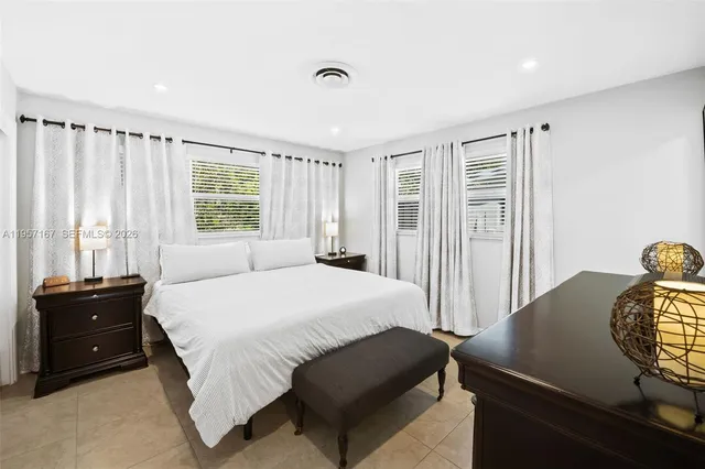 a bedroom with a bed and a closet