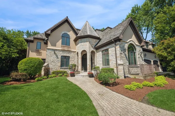 a front view of a house with garden