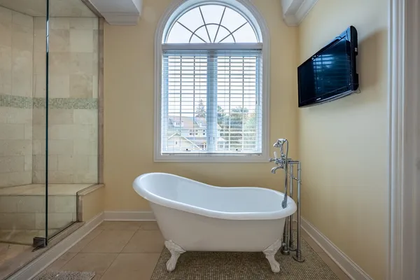 a bathroom with a sink vanity mirror and toilet