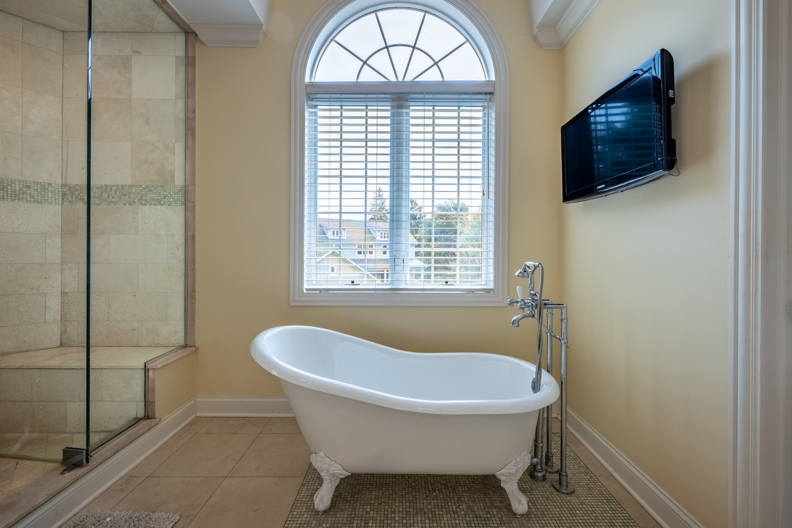 120 Maya Court Deerfield, IL 60015 - Photo 20 of 37 a bathroom with a tub a window and a flat screen tv