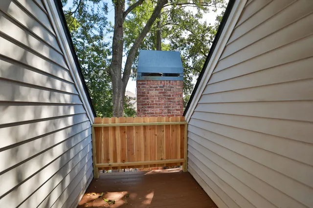 a view of a house with a tree