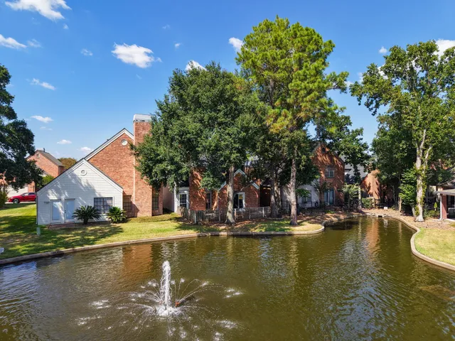a view of swimming pool with outdoor seating and yard