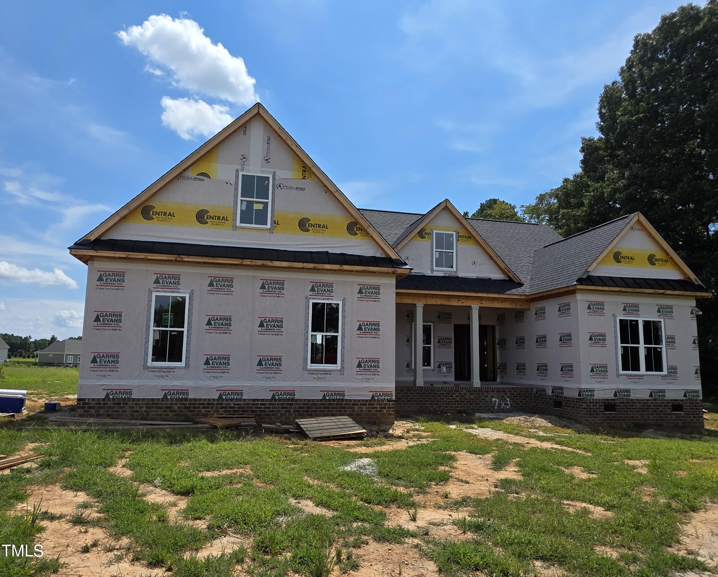 2379 Heartland Road Battleboro, NC 27809 - Photo 2 of 44 a front view of a house with garden